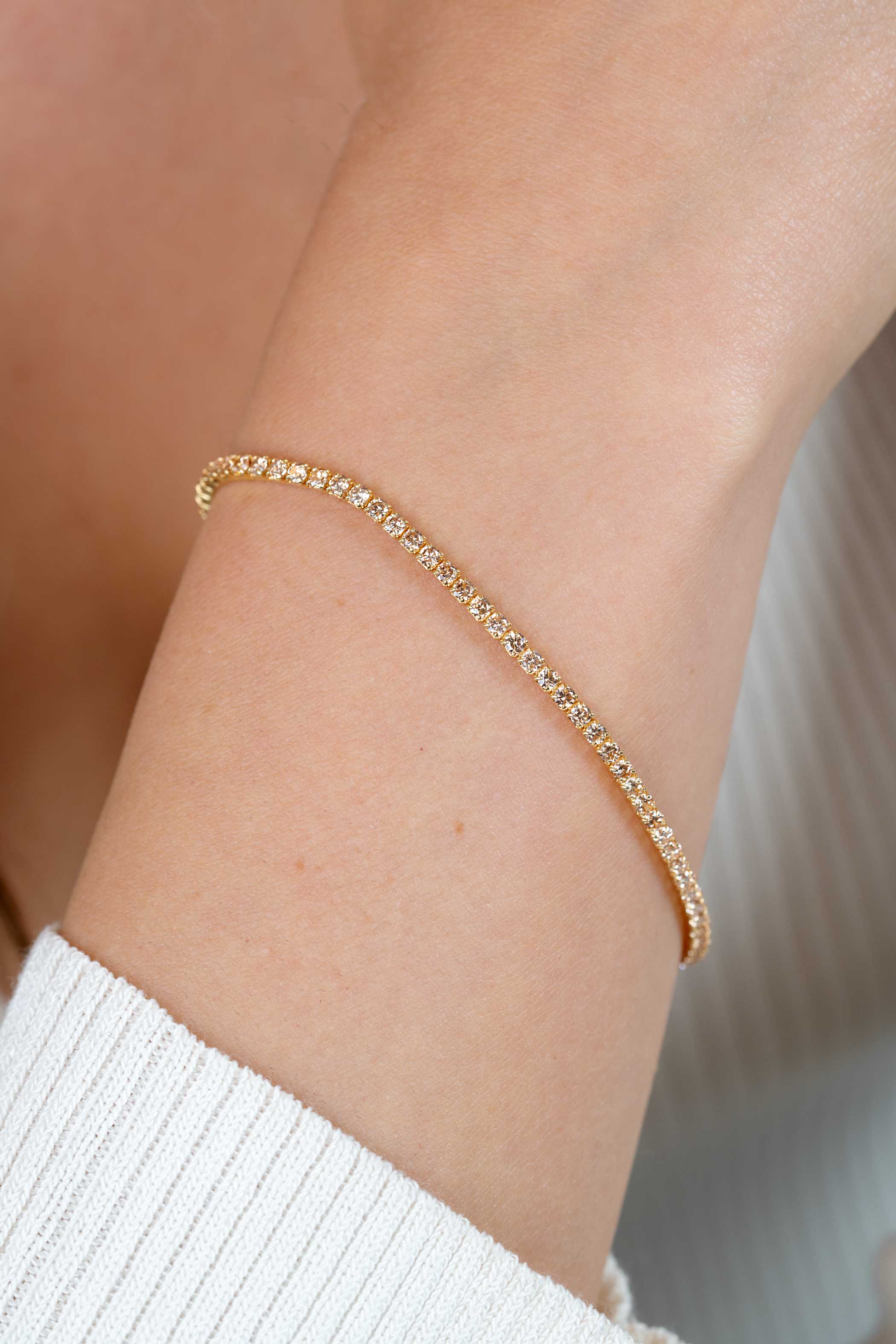 ZINZI gold plated zilveren tennis armband 2,1mm breed met rijzetting champagnekleurige zirconia's ZIA2892C