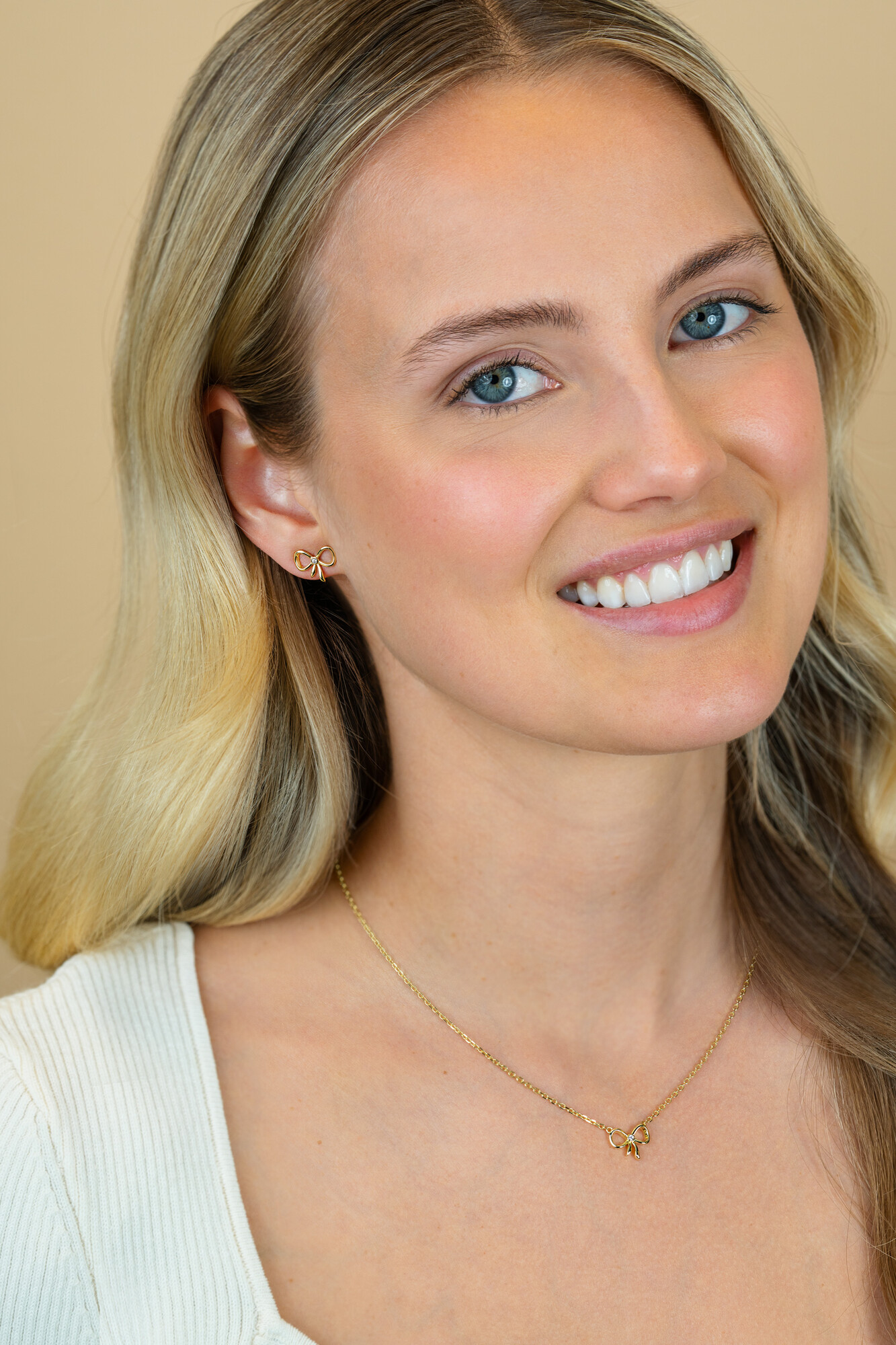 9,5mm ZINZI gold plated zilveren oorstekers strikje met zirkonia ZIO2724Y