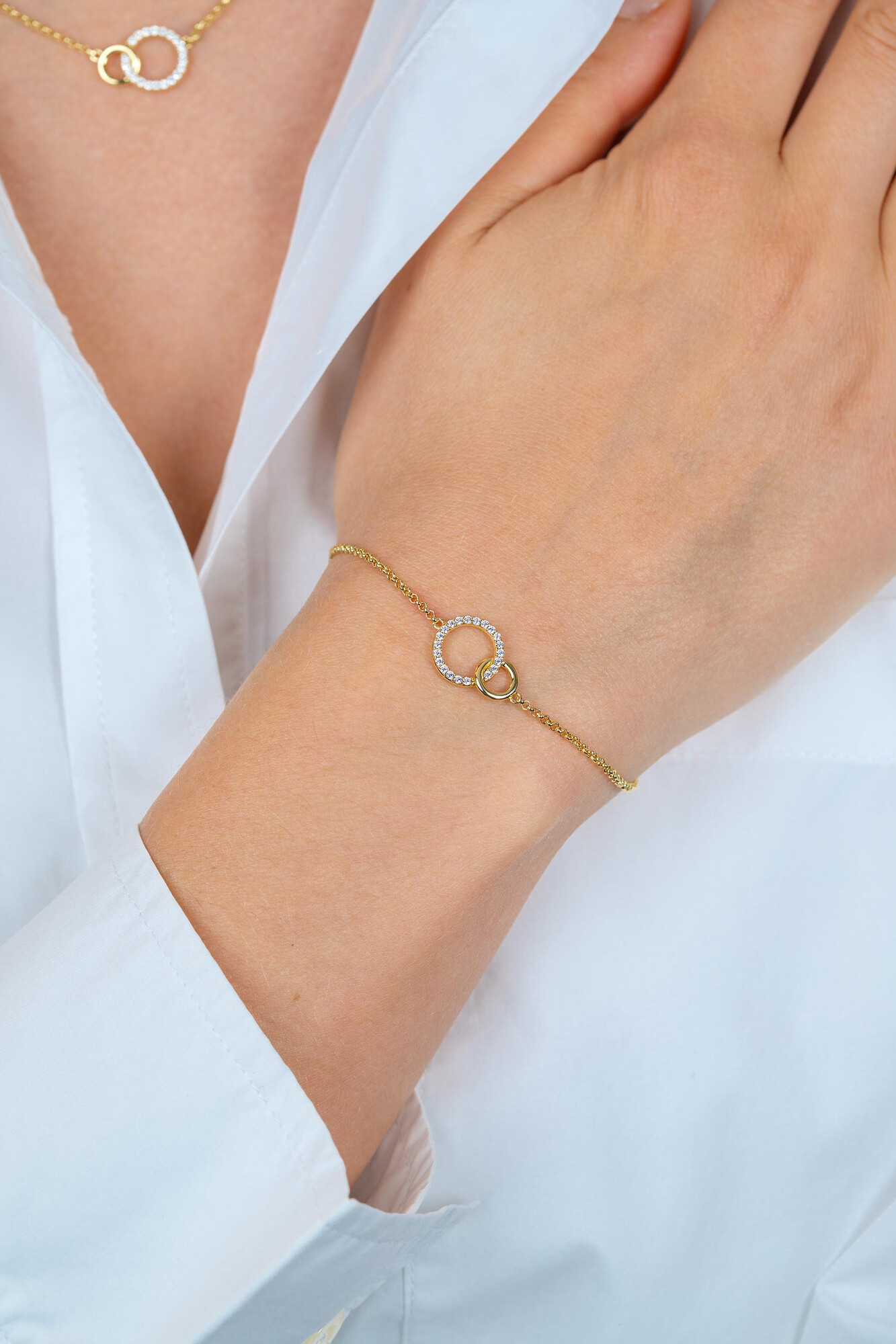 ZINZI goldplated zilveren armband met twee verbonden ronde schakels witte zirconia's ZIA1782Y